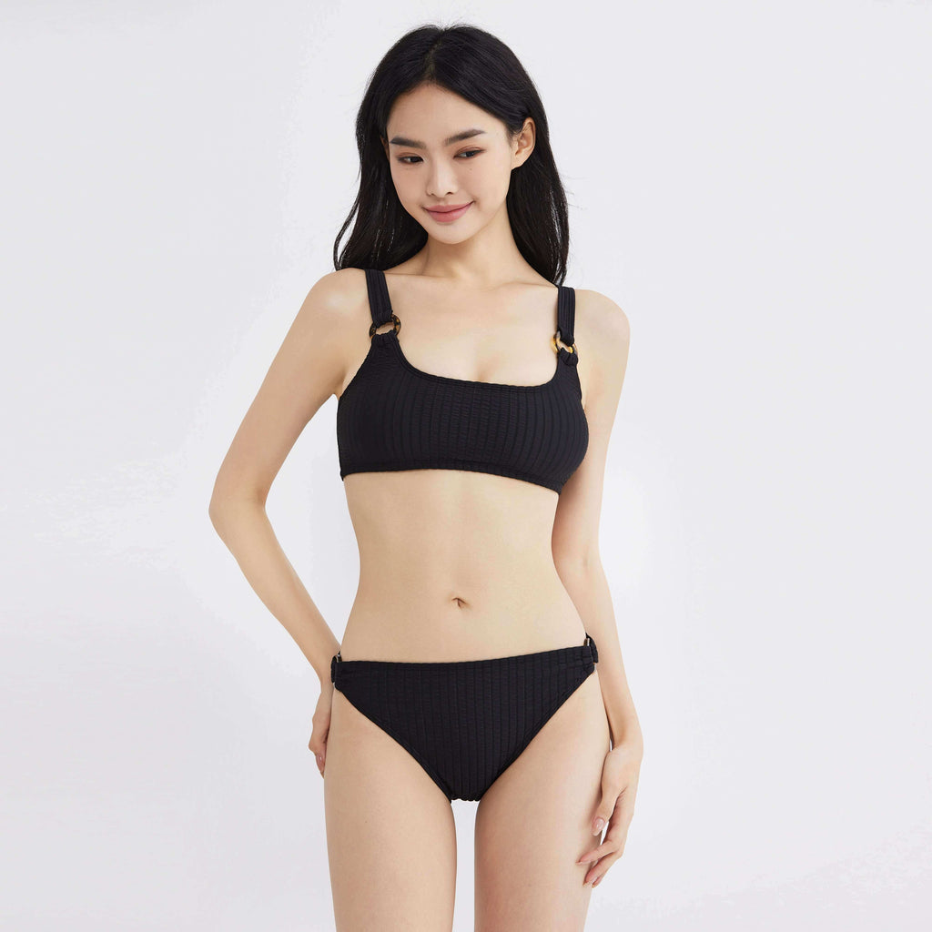 Black ribbed bikini set with adjustable straps and tortoiseshell rings, designed for comfort and style.