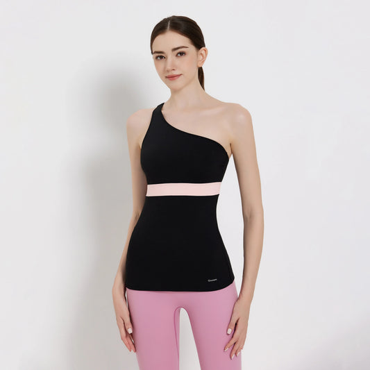 Model wearing a stylish Balance Tank Top, featuring an asymmetrical design and a pink waistband.