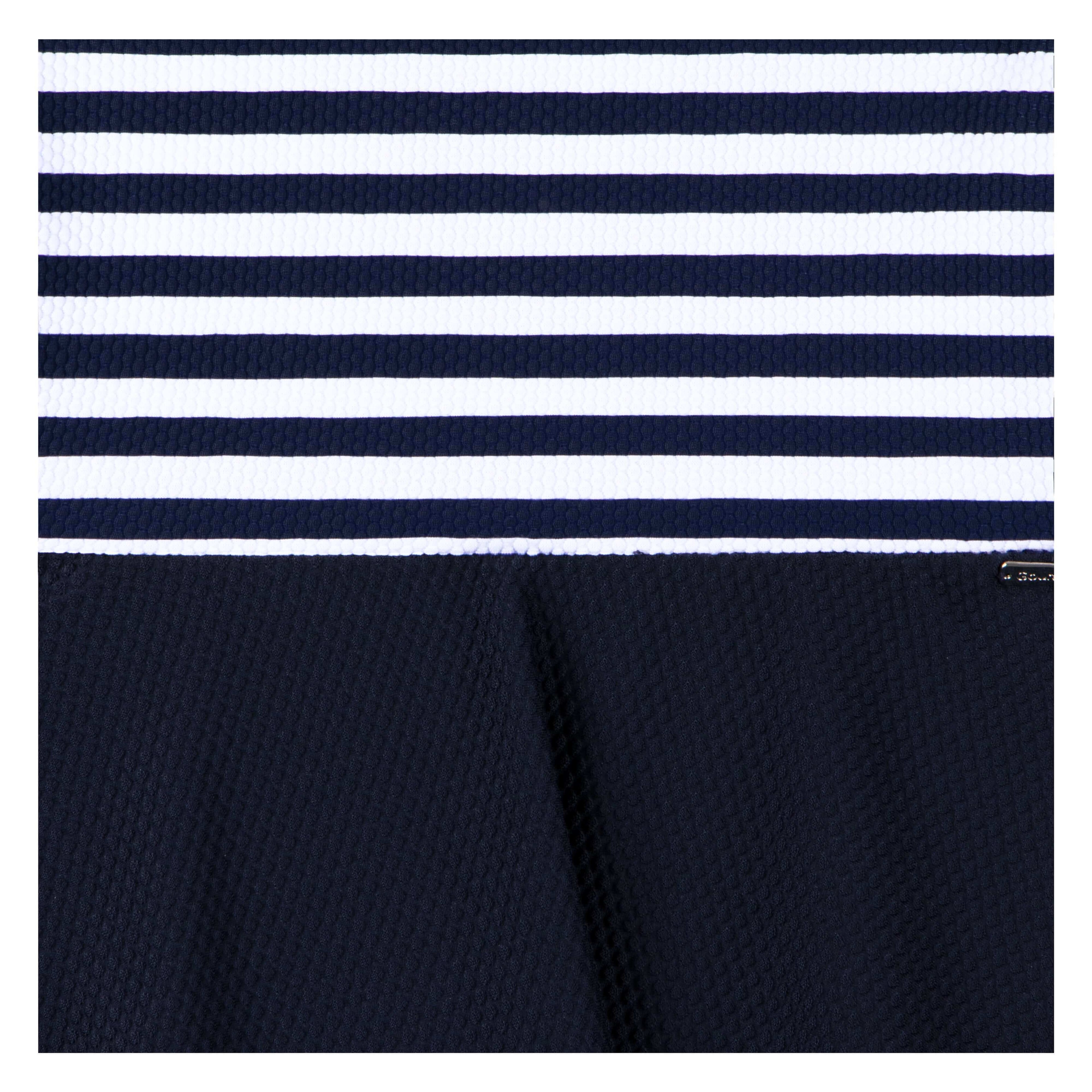 Navy blue and white striped activewear fabric with textured weave, ideal for yoga or gym wear.