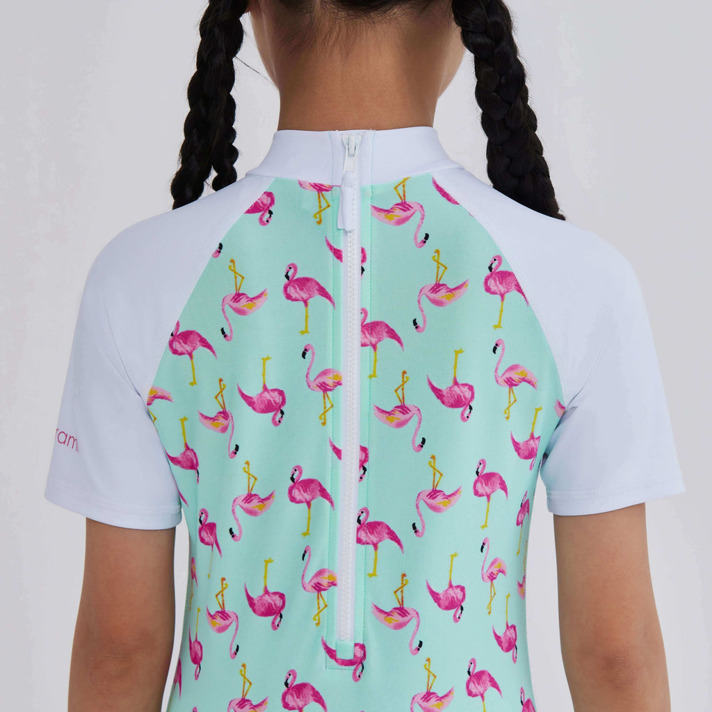 Flamingo print swim top with white sleeves and back zipper, designed for active women
