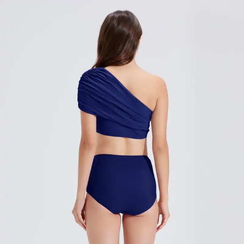 Navy one-shoulder swim top with high-waisted bottoms, designed for real women’s movement and style.