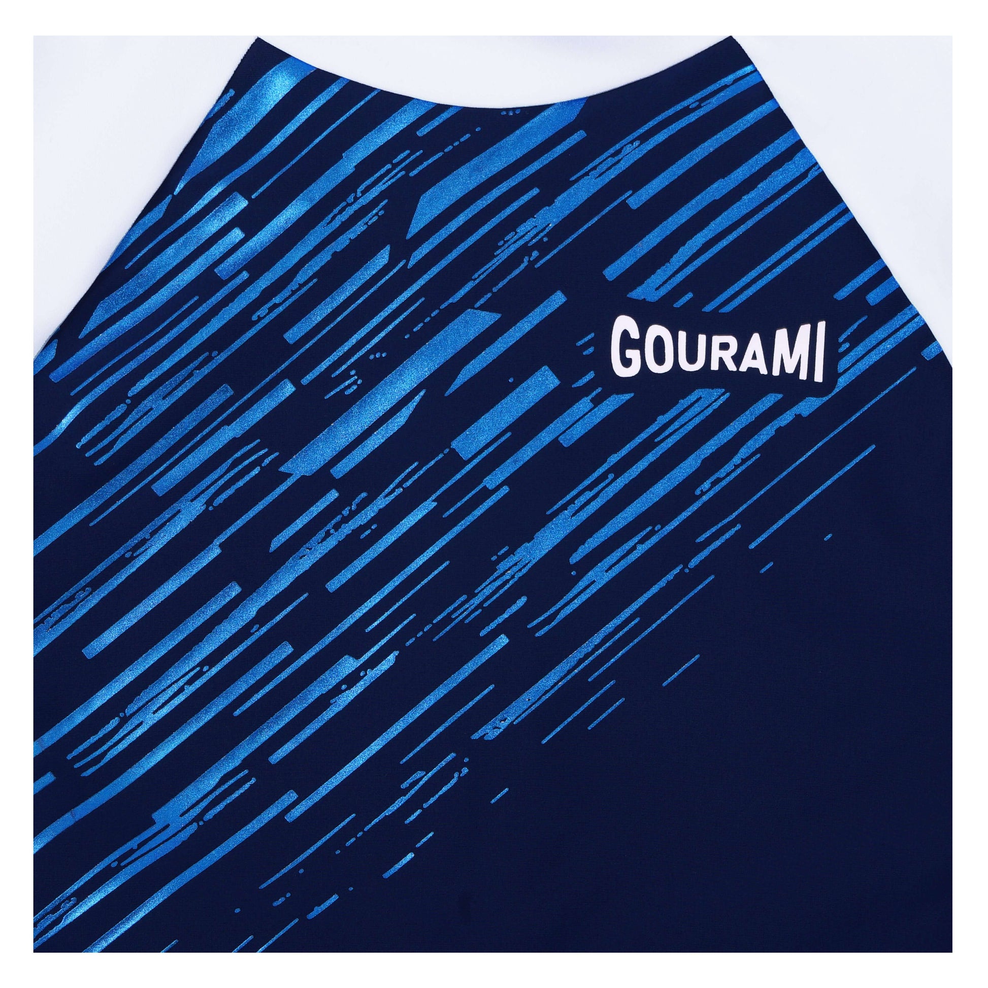 Close-up of Meteor Long Sleeve Swimsuit featuring blue and black abstract design and Gourami branding.