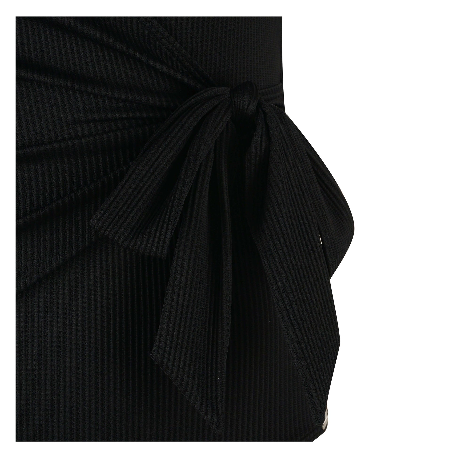 Close-up of the Body Focus swimsuit showing a stylish black knot detail and textured fabric design.
