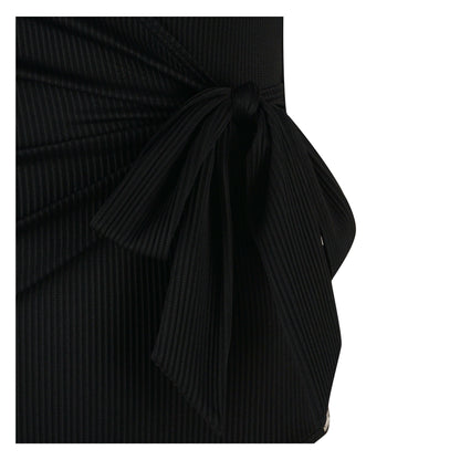 Close-up of the Body Focus swimsuit showing a stylish black knot detail and textured fabric design.