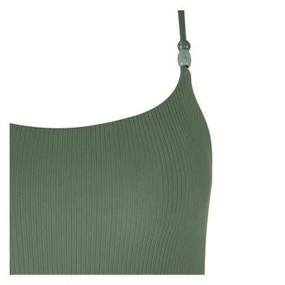 Close-up of a stylish green ribbed beachside swimsuit with decorative strap detail.