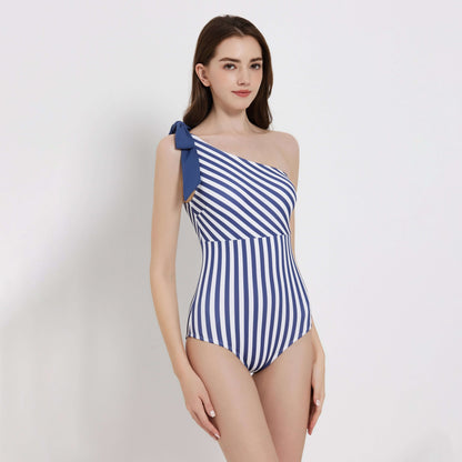 One-shoulder ocean swimsuit with nautical stripes, perfect for summer beach outings.