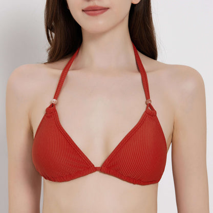 Red ribbed bikini top, perfect for beachside relaxation and summer fun.