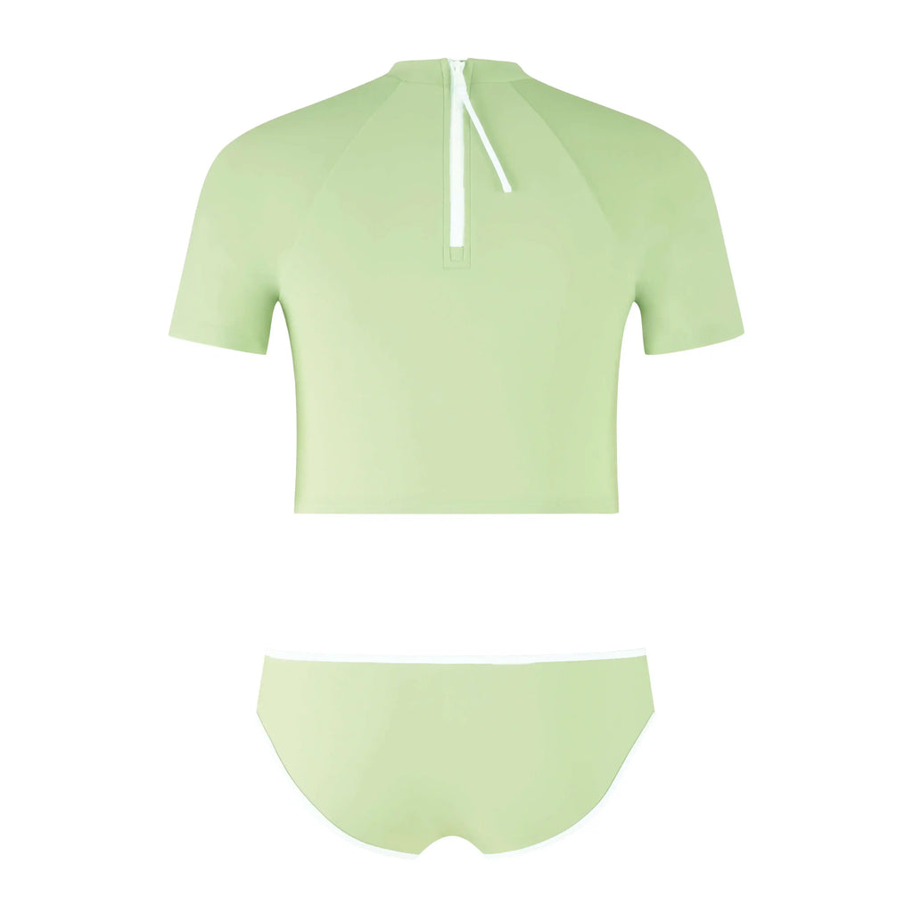 Track Crop Rashguard Set in a light green color, featuring a short-sleeve top and matching bottoms.