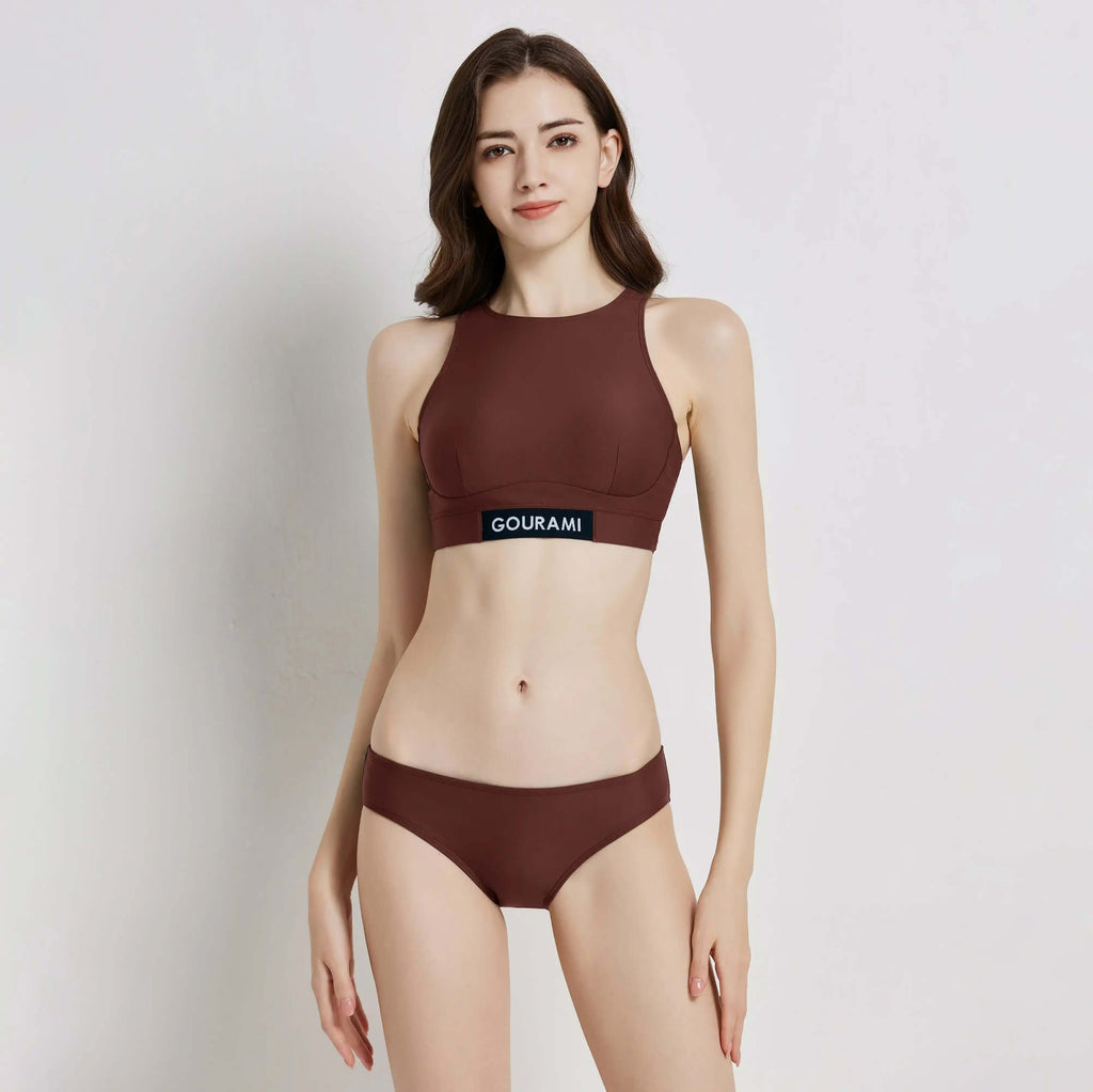 G Sport Bikini model wearing a stylish brown two-piece swimwear with a sporty design and branded top.