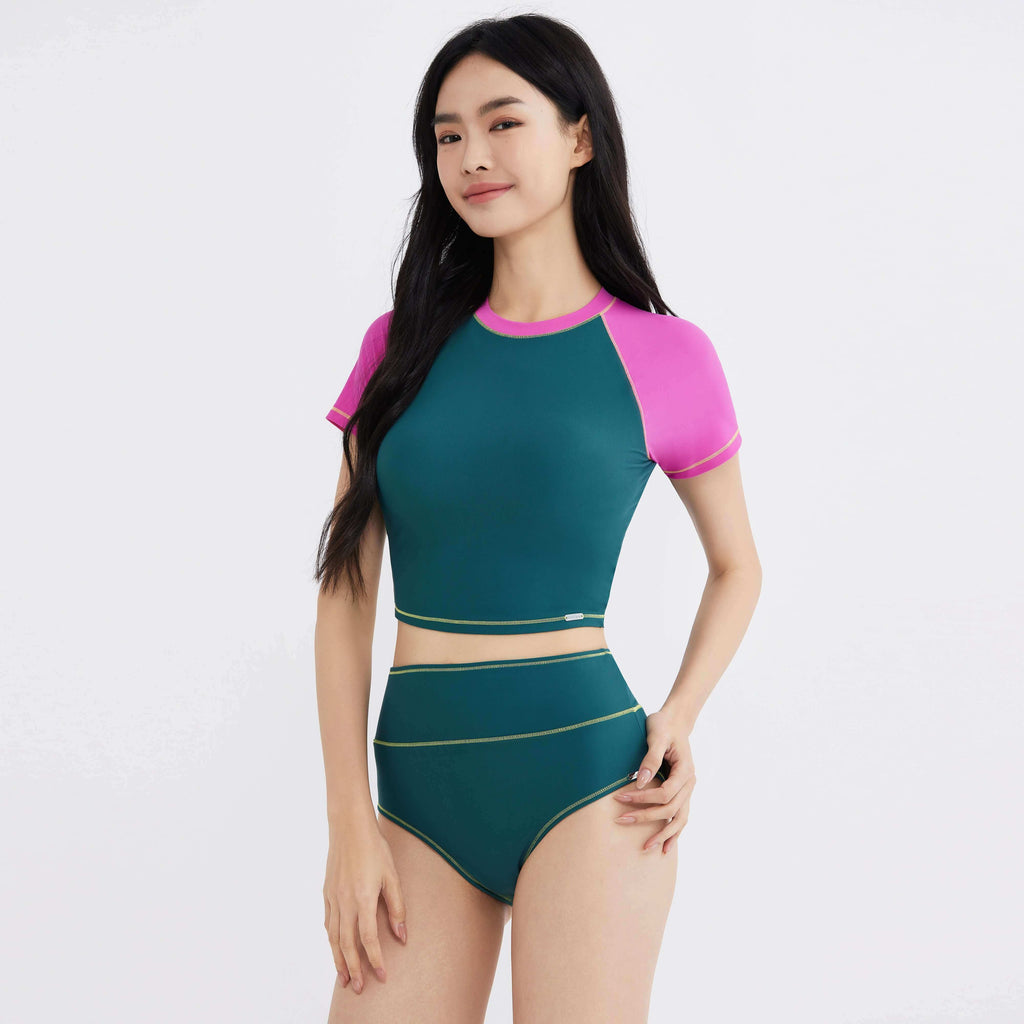 Green and pink activewear set with gold trim, designed for women's comfort and style