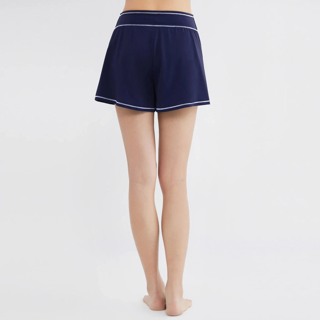 Navy blue swim shorts with white trim, designed for comfort and movement, perfect for swim and activewear.