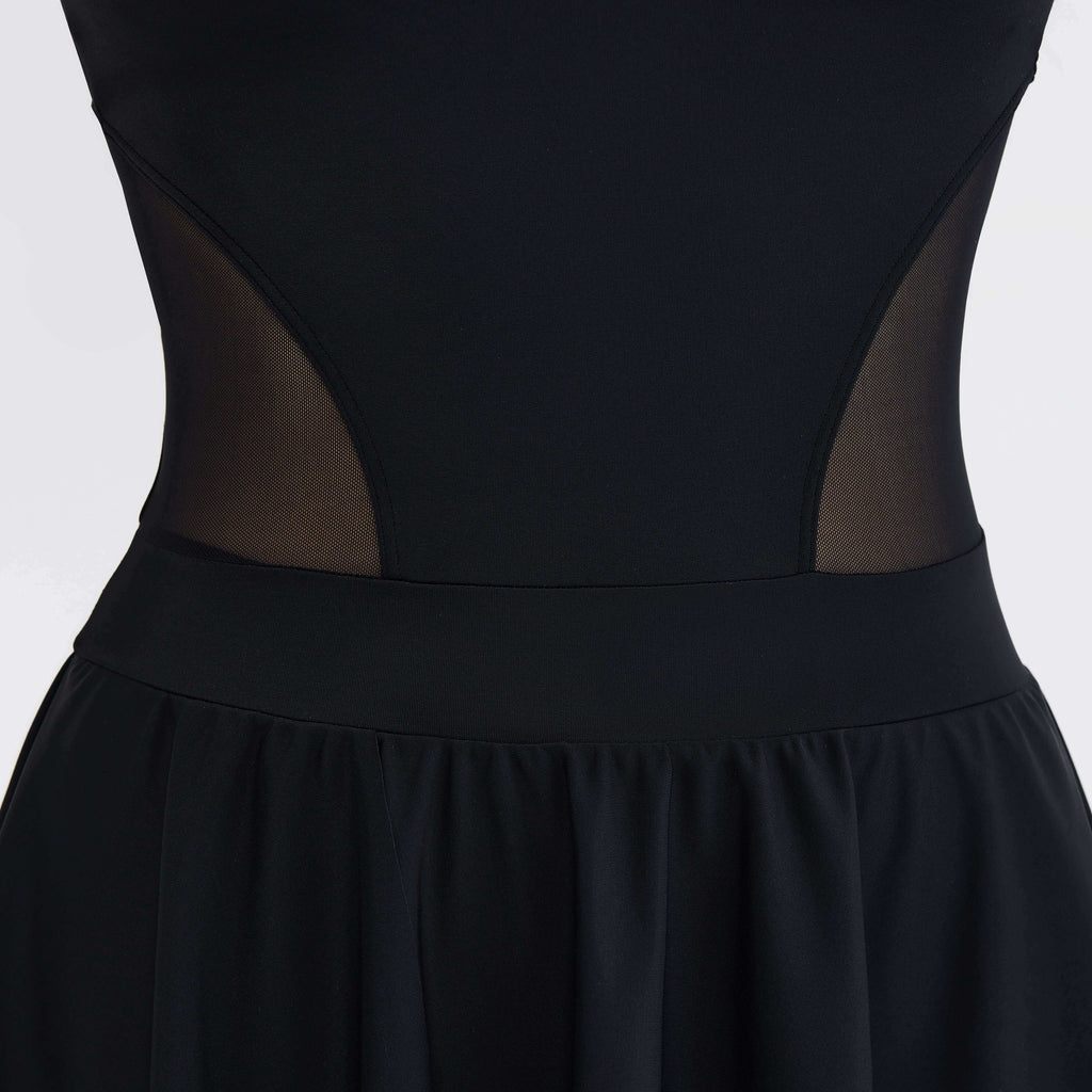 Black one-piece swimsuit with mesh side panels and flared skirt, designed for comfort and movement.