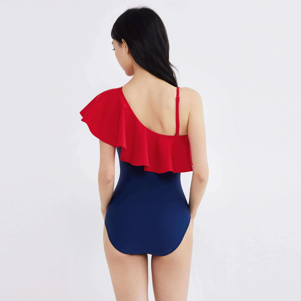 Red and navy one-piece swimsuit with ruffle detail, designed for real women's proportions and active movement.