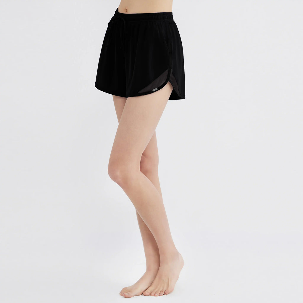 Black drawstring swim shorts with mesh lining, designed for comfort and movement, perfect for active lifestyles.