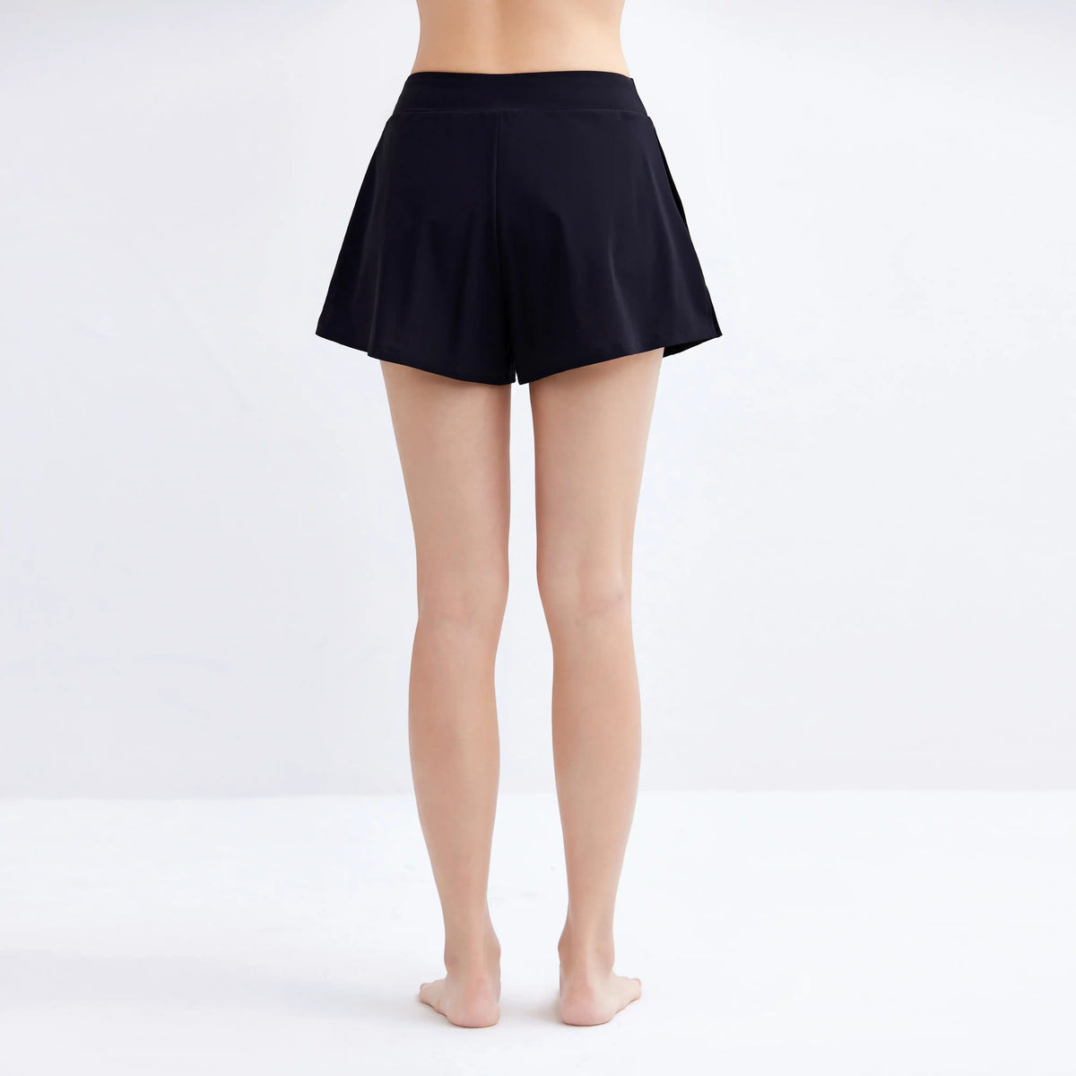 Rear view of Gourami Drift Gym to Swim Shorts in black on a model.
