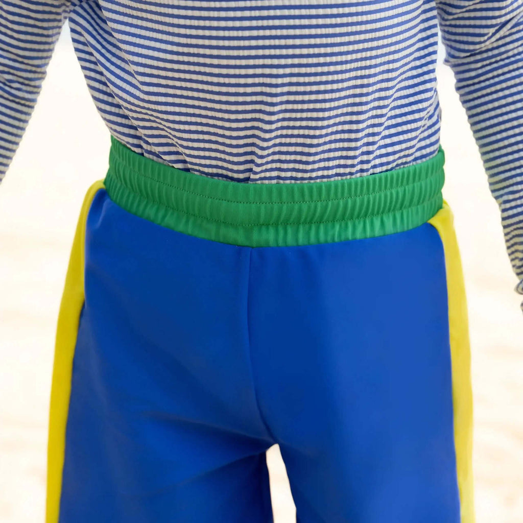 Candy Stripe Boys Rashguard Set featuring a striped top and colorful shorts for fun beach days.