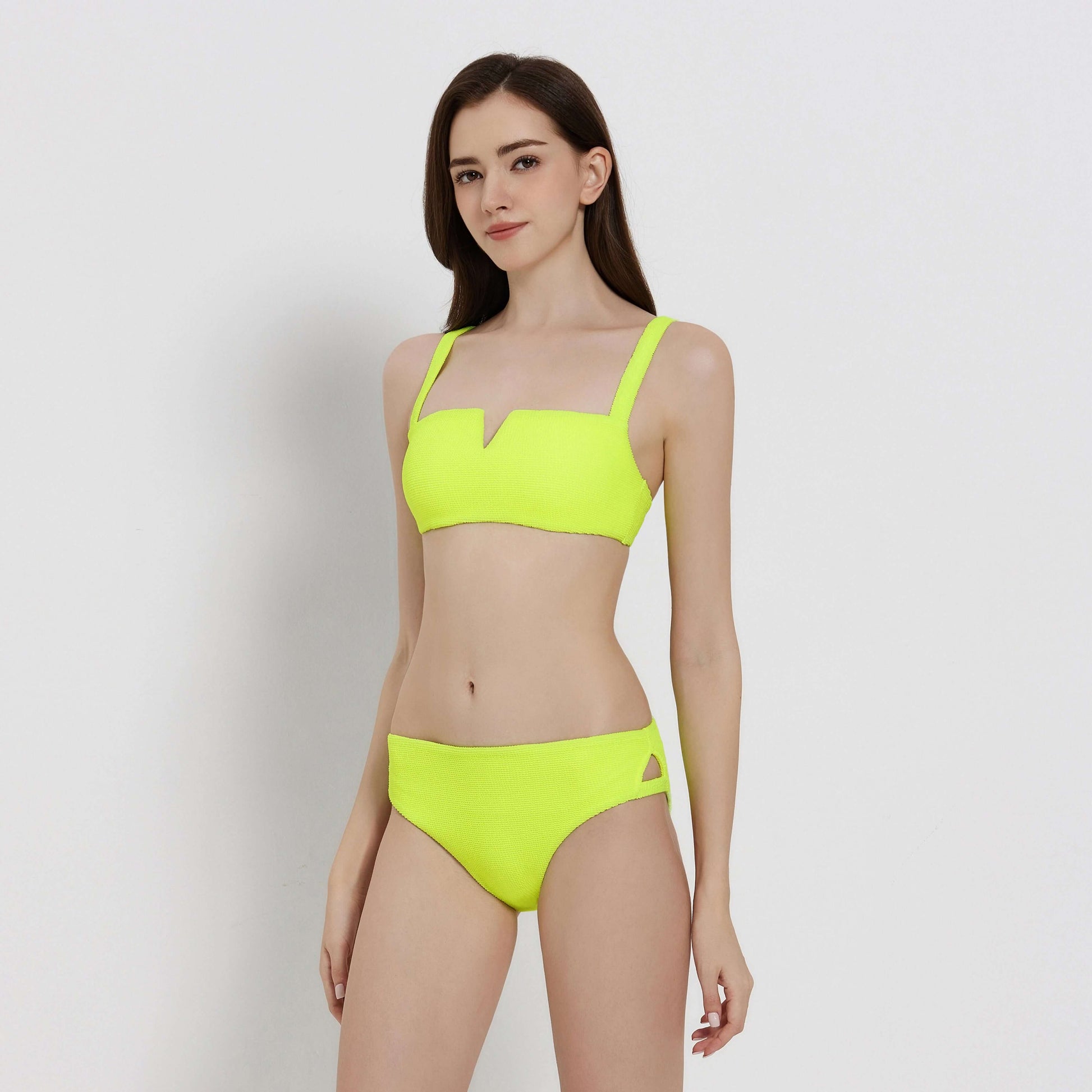 Elevated bikini in bright neon yellow, featuring a stylish square neckline and matching high-waisted bottoms.