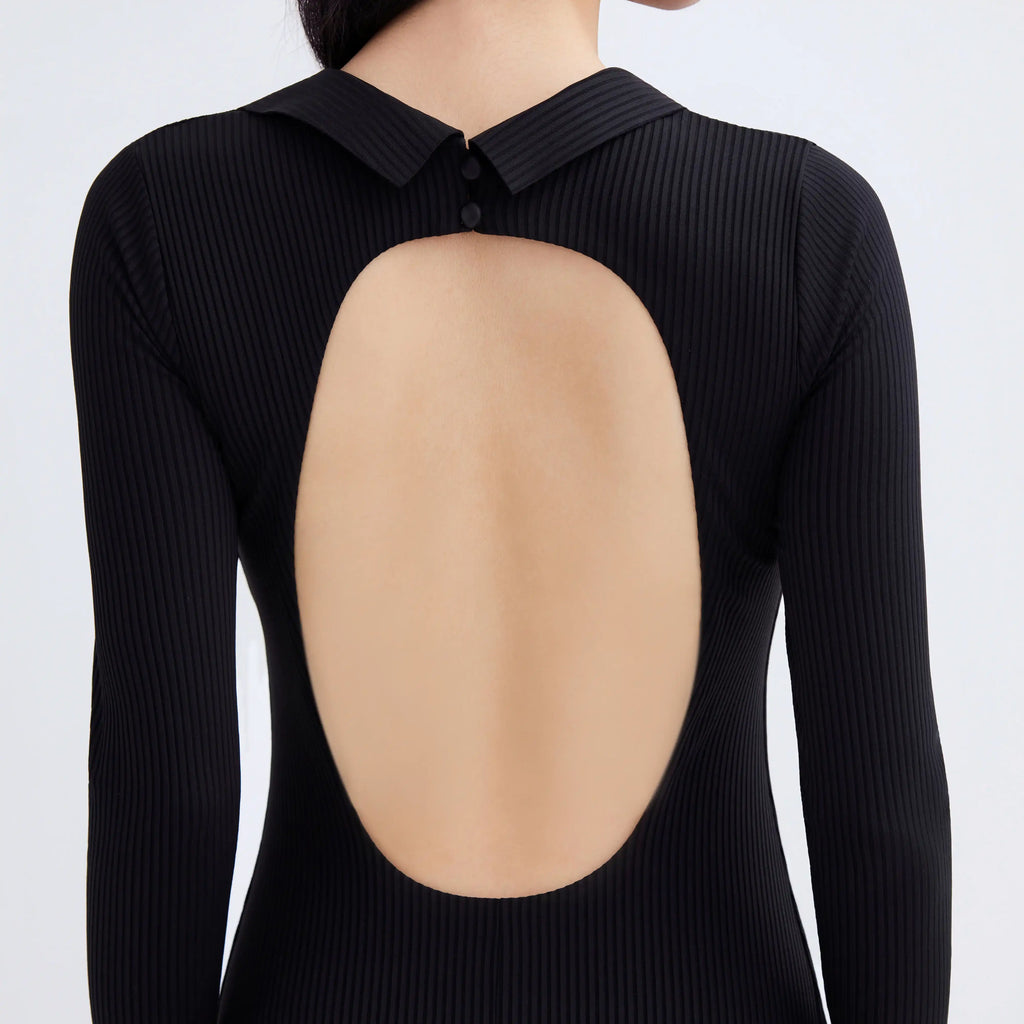 Back view of Gourami Capsule Long Sleeve Swimsuit in black ribbed fabric with an oval cutout.